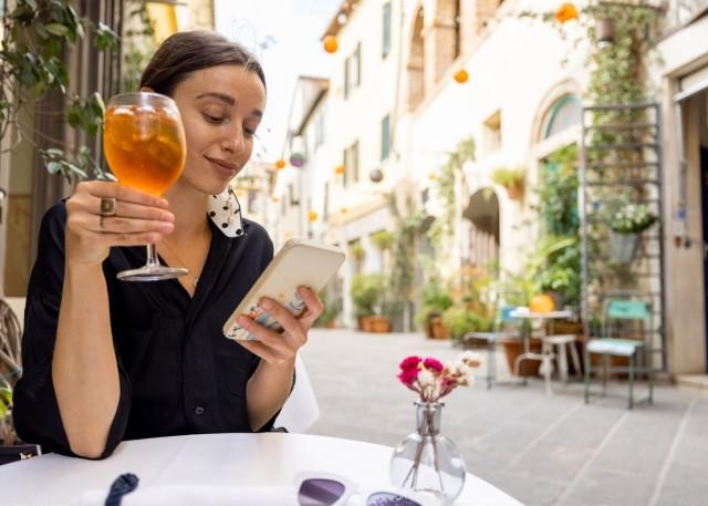 woman with wine and app